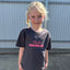 the front side of a young girl in a wakeboard division t shirt