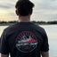 a man looking at the water wearing a Bunda lip t shirt from Skin Ski + Surf